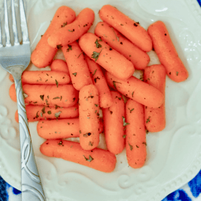 butter garlic carrots on a plate