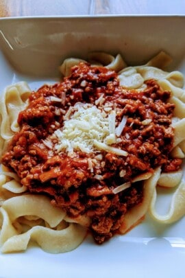 bolognese sauce on pasta plated
