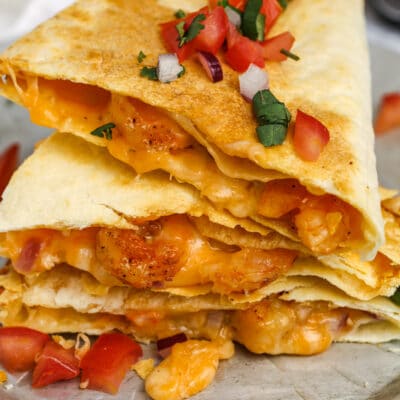 a plate of stacked shrimp quesadilla
