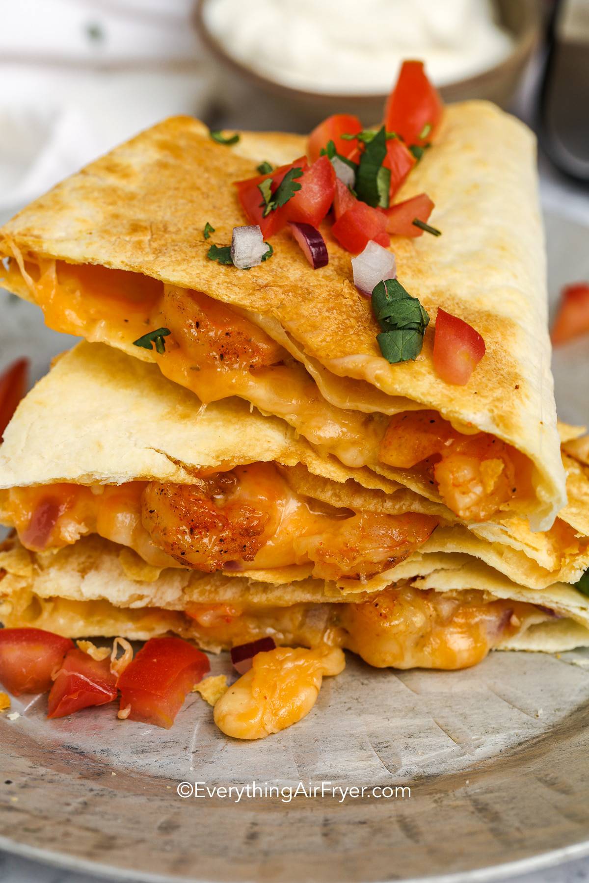 a plate of stacked shrimp quesadilla