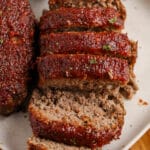 meatloaf with a bourbon sauce sliced on a plate