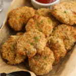 homemade chicken nuggets on a plate with ketchup