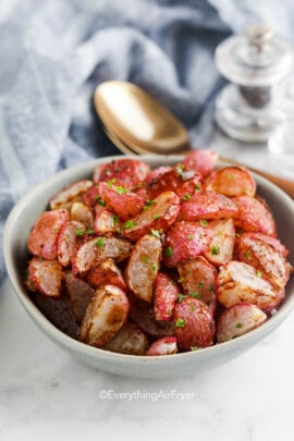 roasted radishes with parsley in a bowl
