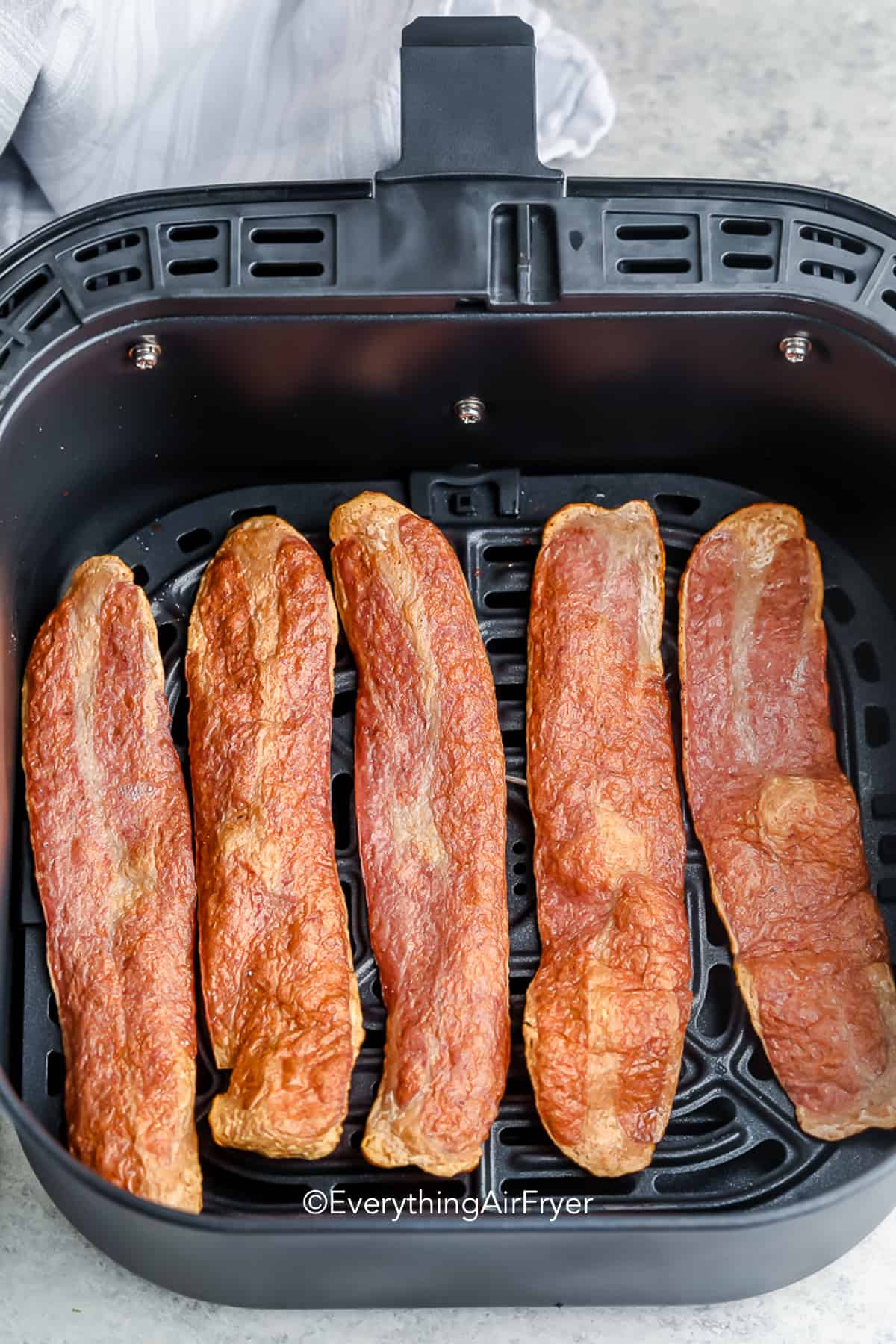 turkey bacon in an air fryer basket
