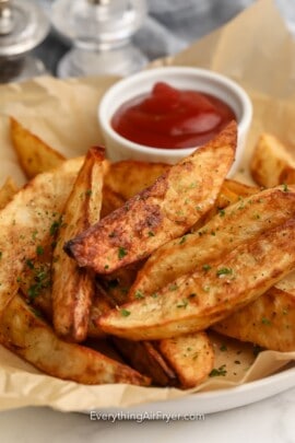 Air Fryer Potato Wedges plated with Ketchup.
