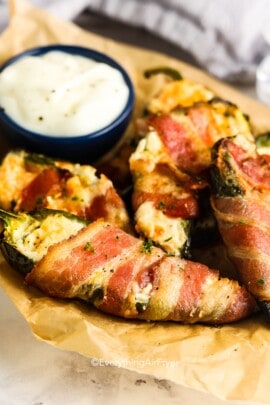 air fryer bacon wrapped jalapenos on a plate