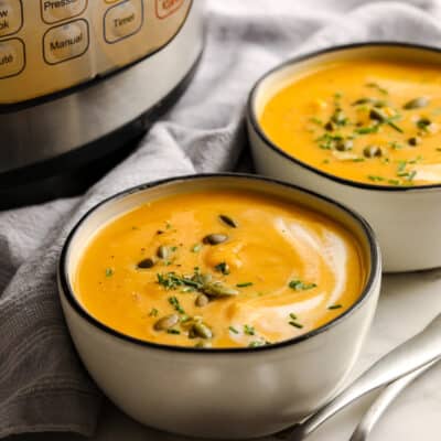 butternut squash soup in a bowl with pepitas