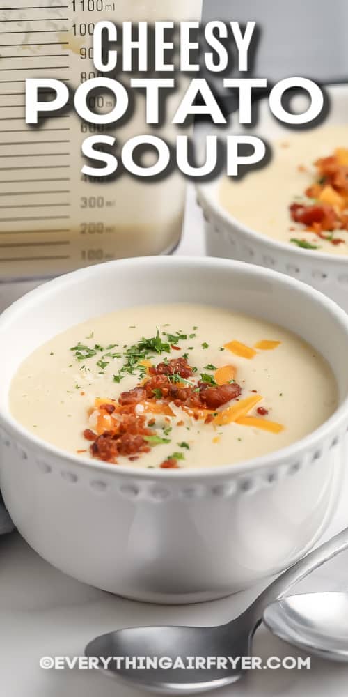 A bowl of cheesy potato soup with text.