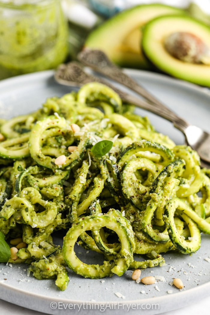 plated Avocado Pesto Zoodles with a fork