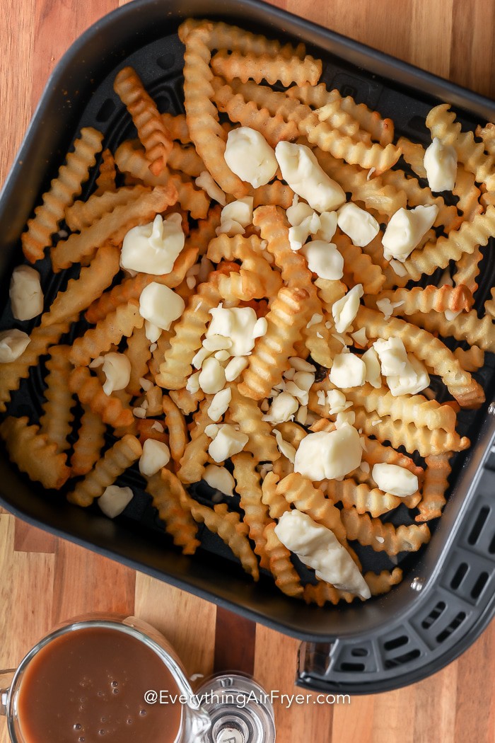 ingredients for Air Fryer Poutine in an air fryer tray