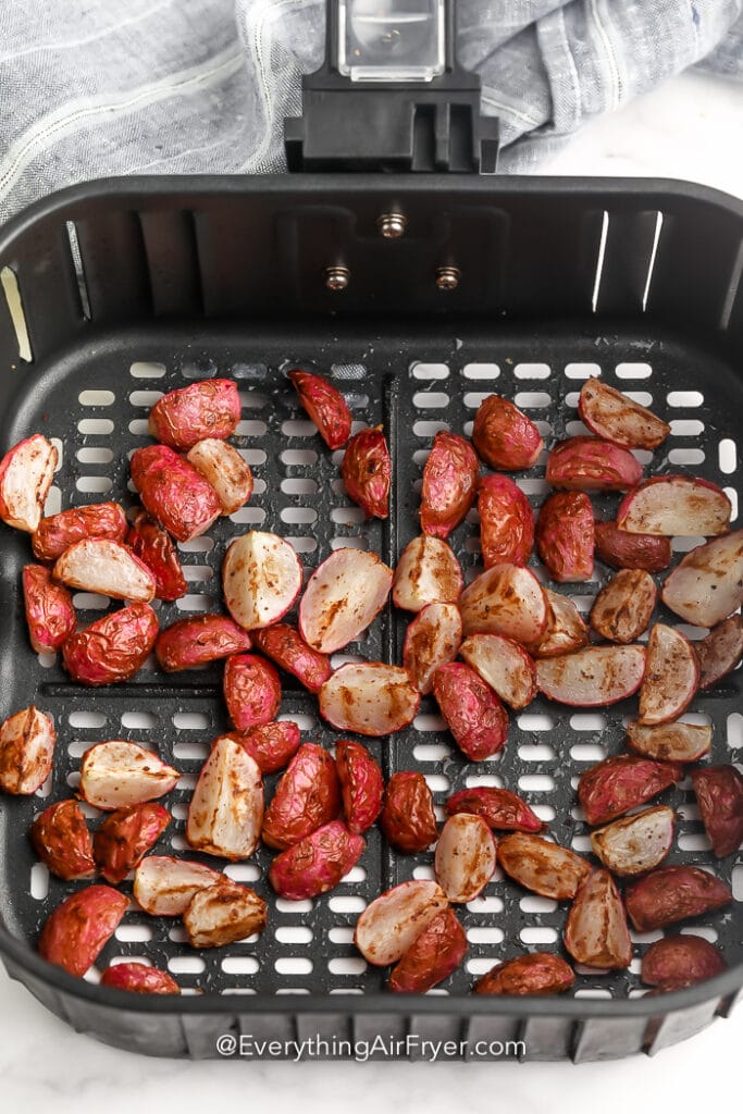 cooked radishes in an air fryer pan