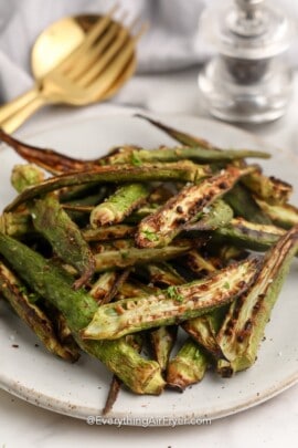 Roasted Okra on a plate topped with parsley