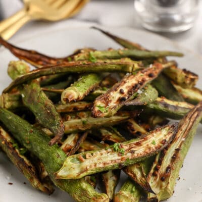 Roasted Okra on a plate topped with parsley