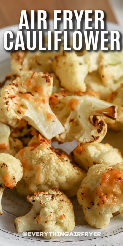A plate of cheesy air fryer cauliflower with writing