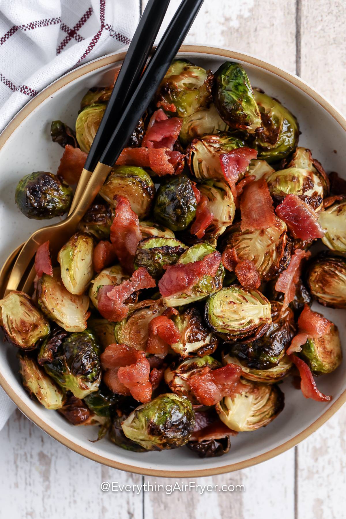 A serving dish of air fryer brussels sprouts with bacon