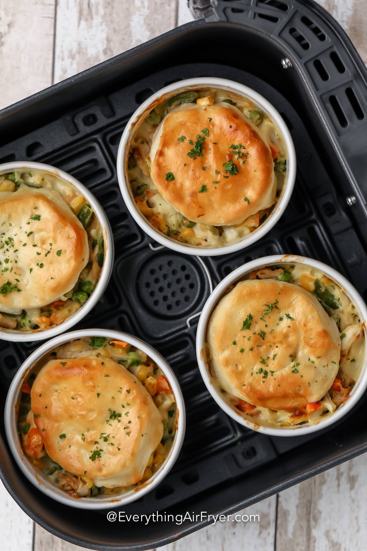 Chicken Pot Pies cooked in an air fryer basket.