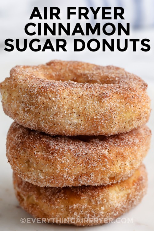 Three air fryer cinnamon sugar donuts stacked with writing
