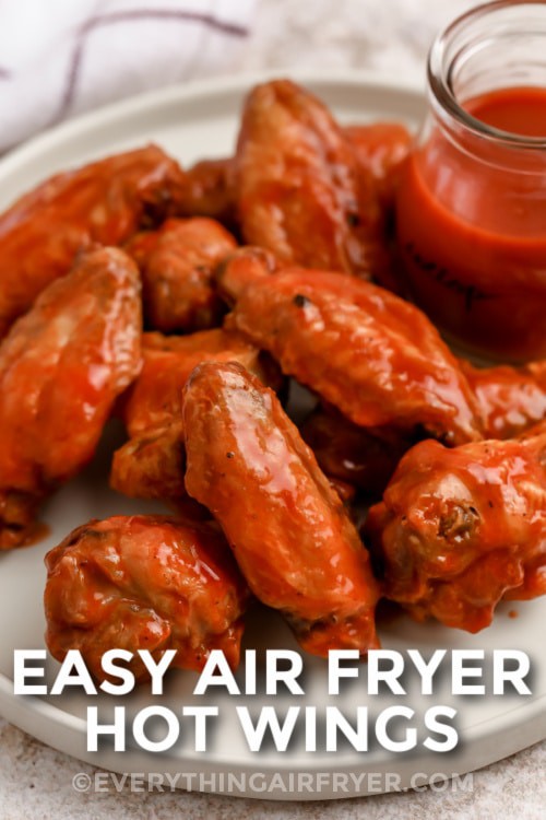 Easy Air Fryer Hot Wings on a plate with writing