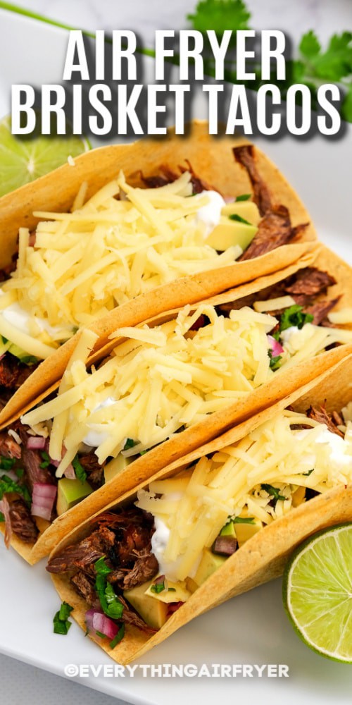 Air Fryer Brisket Tacos on a plate with text.