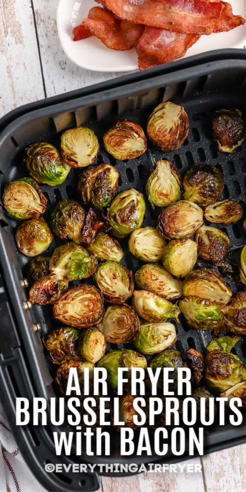 Brussels sprouts in an air fryer basket with bacon on the side with writing