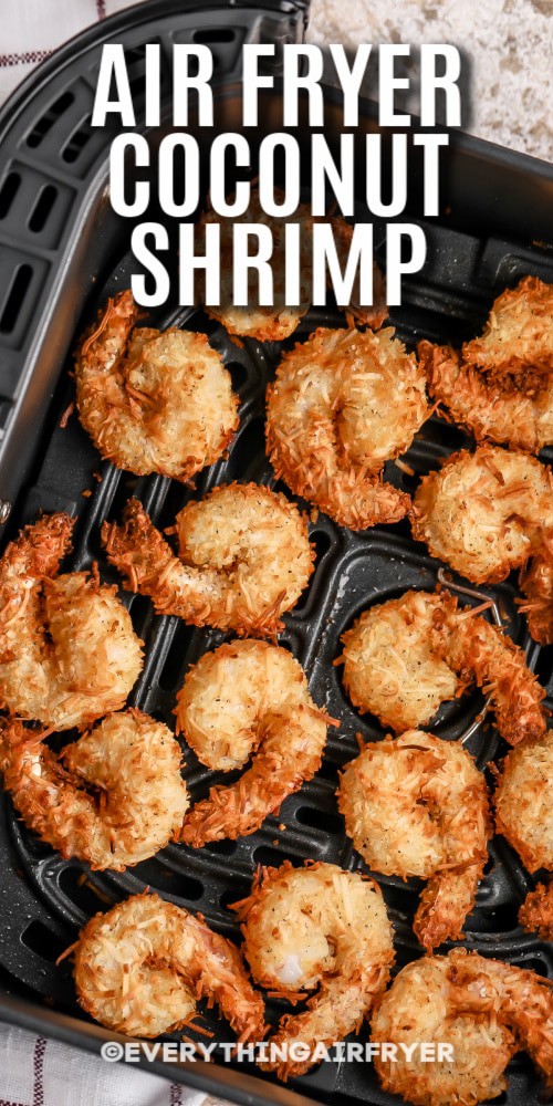 Coconut Shrimp cooked in an air fryer basket with writing