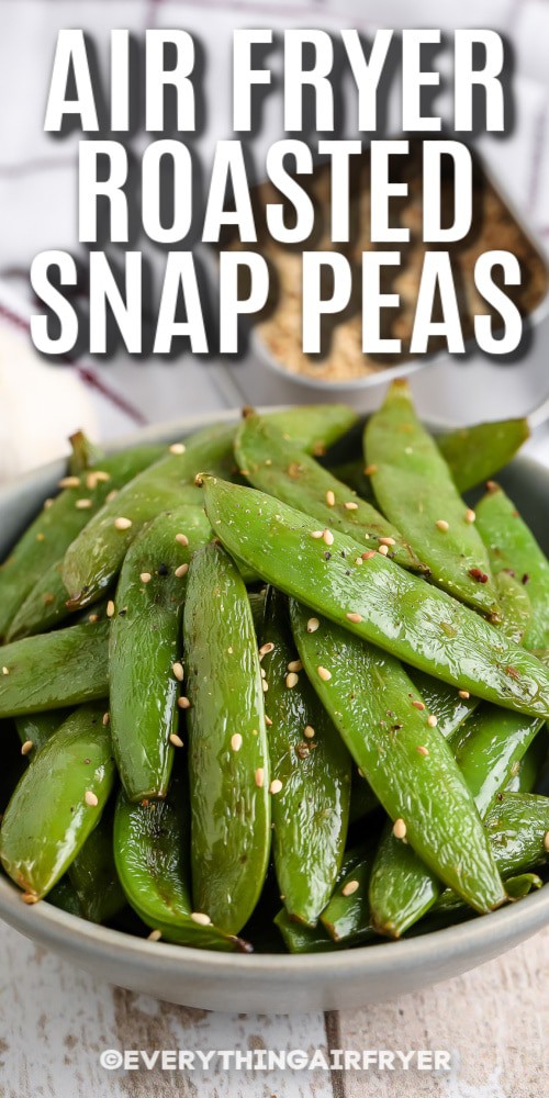 A bowl of air fryer roasted snap peas with writing