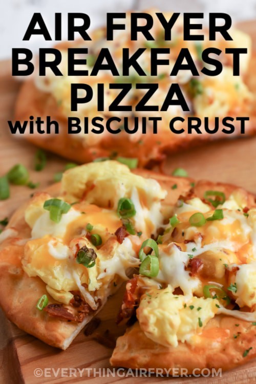 Air Fryer Breakfast Pizza with Biscuit Crust on a cutting board with writing