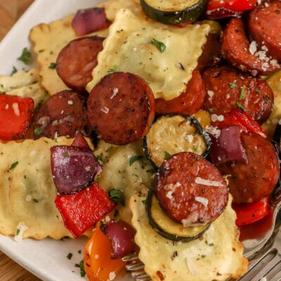 Air Fryer Mixed Vegetables with Ravioli and Sausage being served