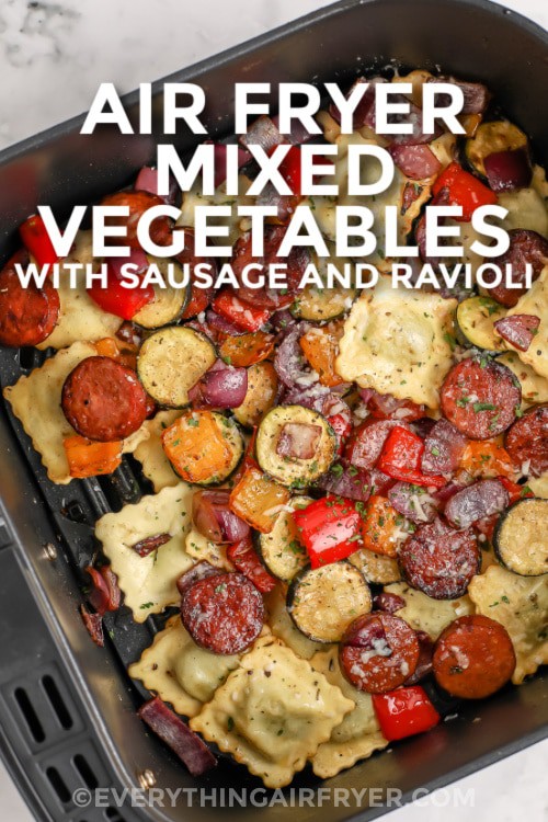 Mixed Vegetables with Ravioli and Sausage cooked in an air fryer basket with writing