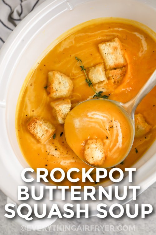 Crockpot Butternut Squash Soup garnished with croutons with writing
