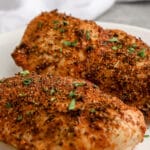 Air Fryer Chicken Breasts on a plate with writing