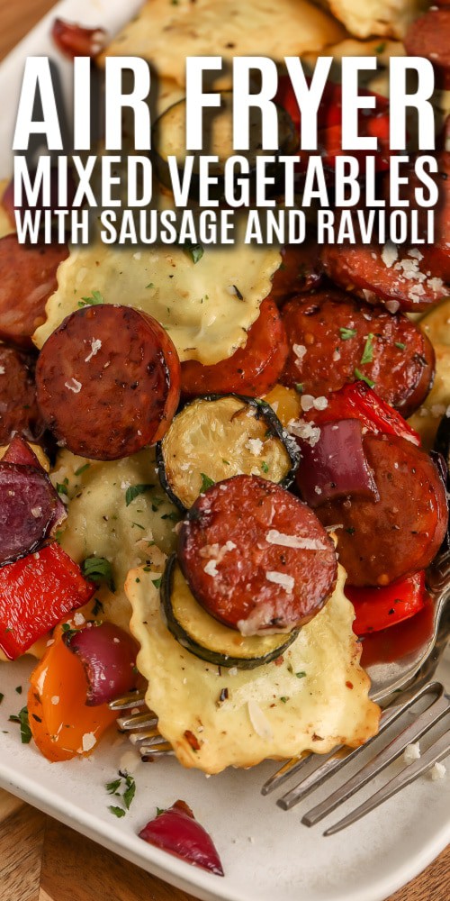 Air Fryer Mixed Vegetables with Ravioli and Sausage on a serving plate with writing