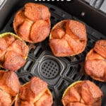 Air Fryer Monkey Bread Minis prepped in an air fryer basket with writing