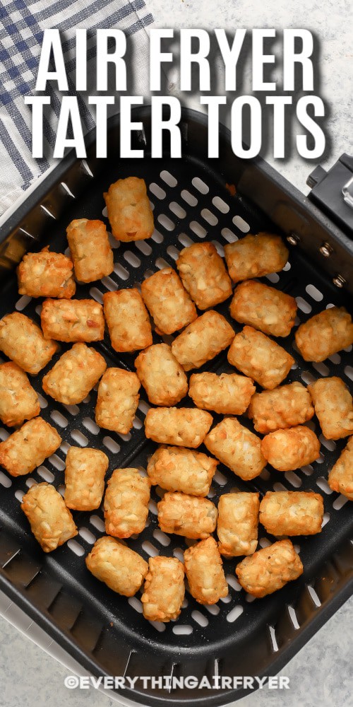 Tater Tots in an Air Fryer basket with writing