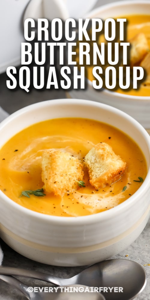 A bowl of Crockpot Butternut Squash Soup with writing