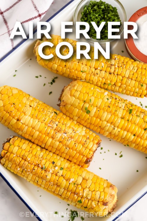 A plate of air fryer corn on the cob with writing