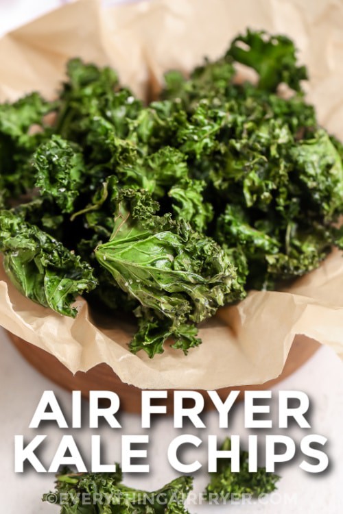 A serving dish of air fryer kale chips with writing
