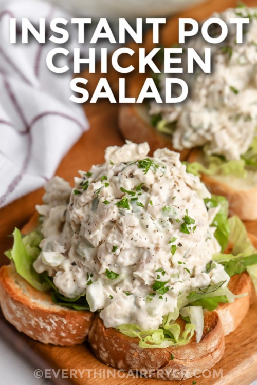 Chicken salad on bread with writing