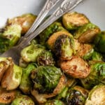 A bowl of air fryer brussels sprouts with writing
