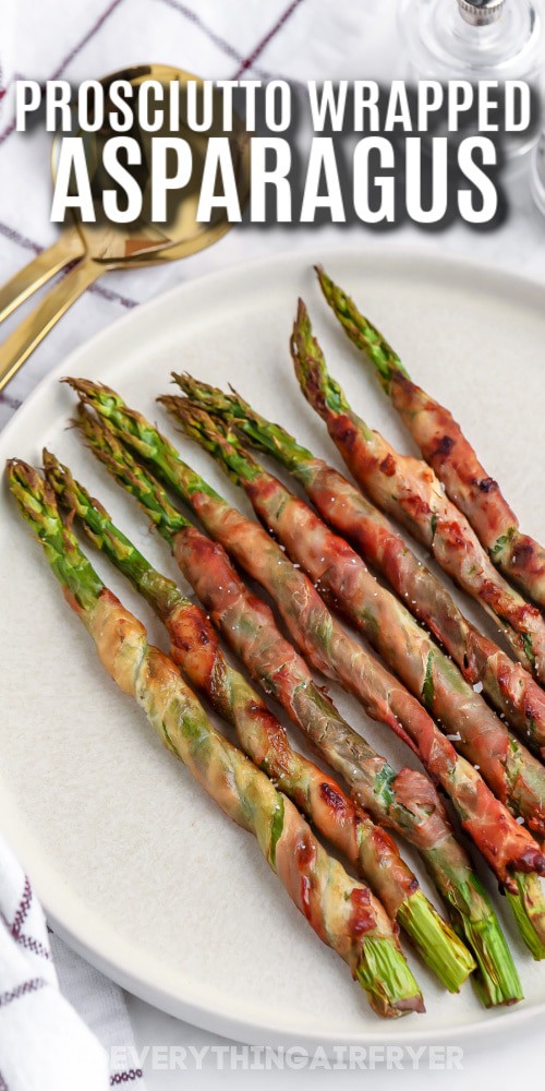 Air Fryer Prosciutto Wrapped Asparagus on a plate with writing