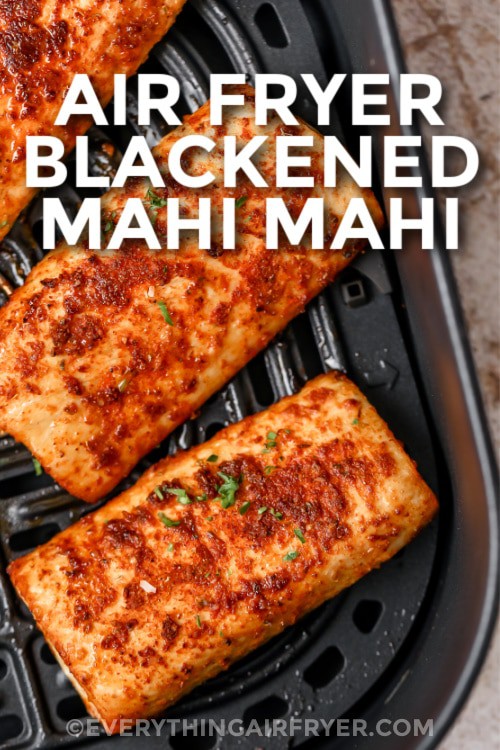 Blackened Mahi Mahi cooked in an air fryer basket with a title