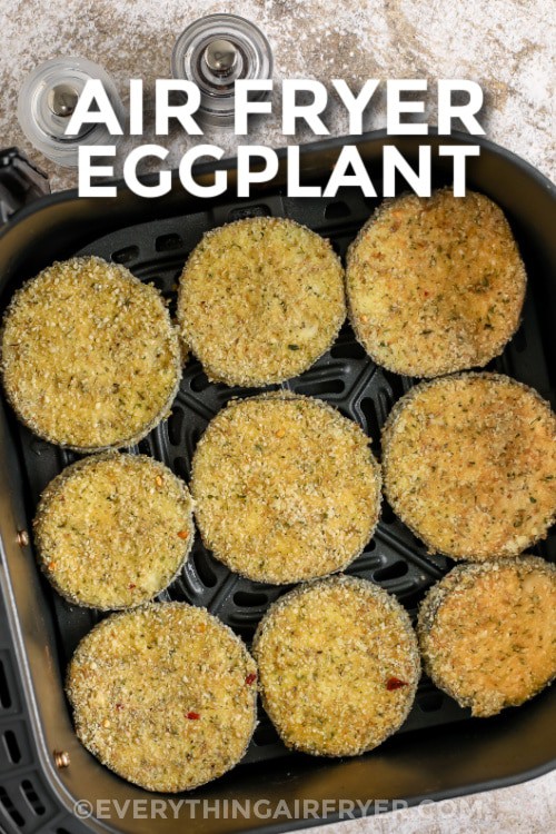 Breaded eggplant cooked in an air fryer basket with a title