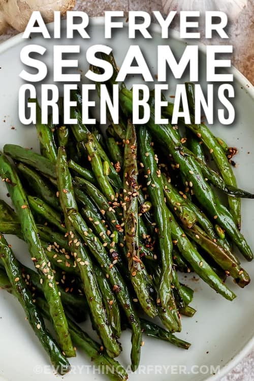 cooked green beans in on a plate with text