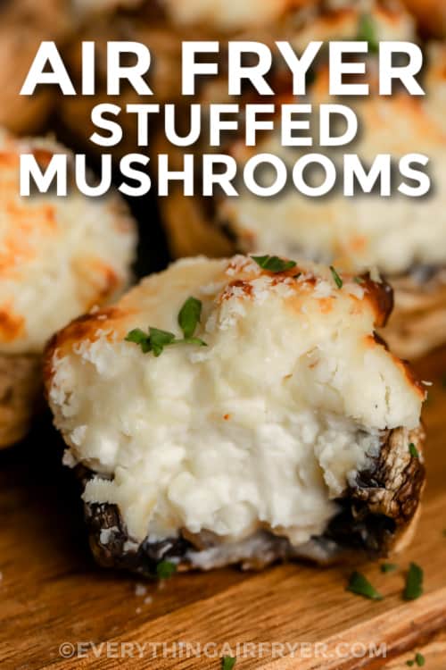 close up of a cheese stuffed mushrooms with a title