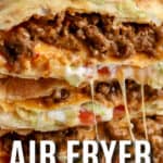 Air Fryer Crunchwrap Supreme stacked on a serving plate with a title