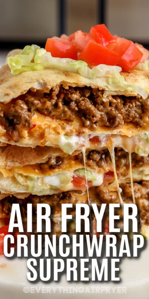 Air Fryer Crunchwrap Supreme stacked on a serving plate with a title