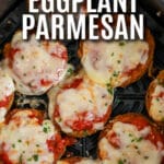 Cooked Eggplant Parmesan in an air fryer basket with a title
