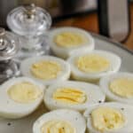 hard boiled eggs with salt & pepper on a plate