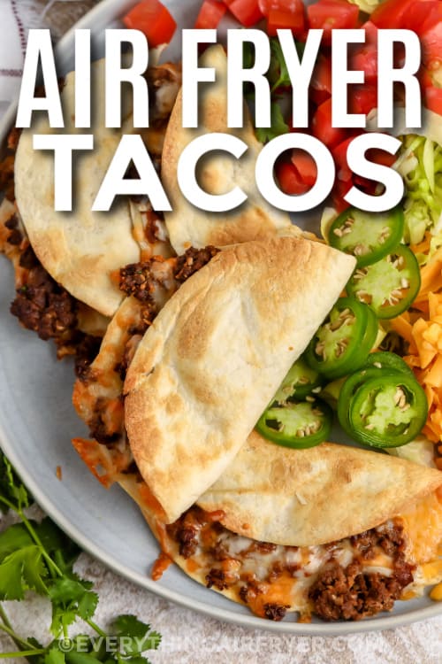 tacos on a plate with text