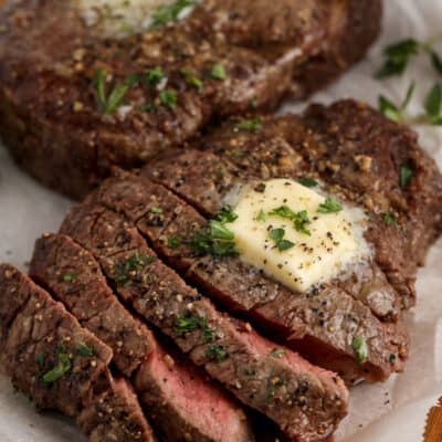 sliced cooked steak with butter